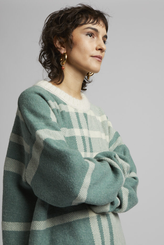 women is wearing MIOMARTHA knitted oversized sweater in green cream - SKU 2022HS001